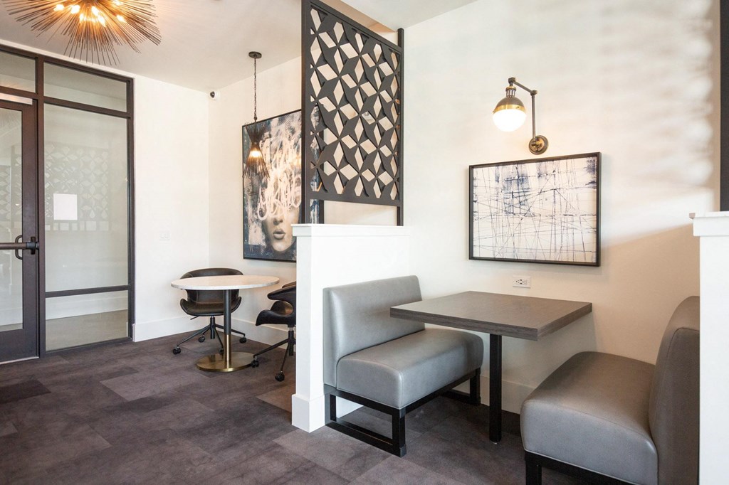 a dining room with a table and chairs and a door