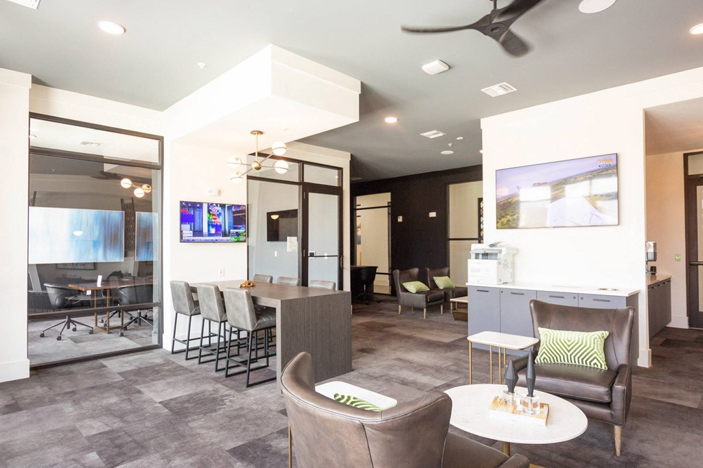 a living room and dining room with a bar and a kitchen