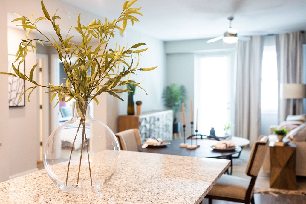 a vase with flowers on a table in a living room