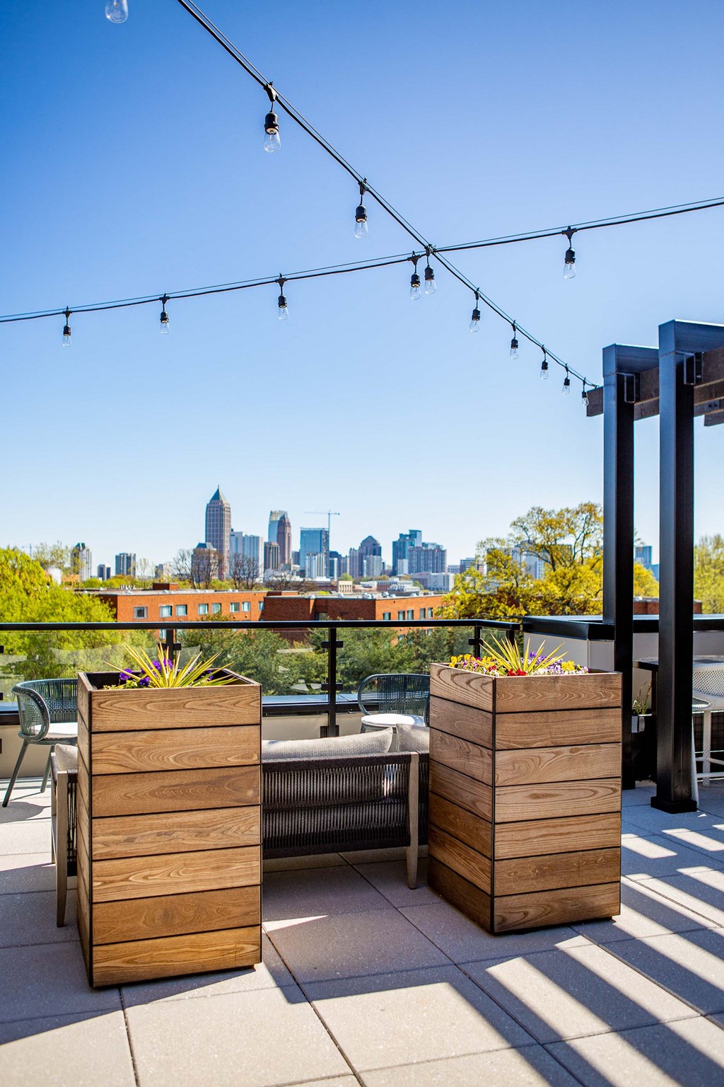 the view of the city from the rooftop terrace of person