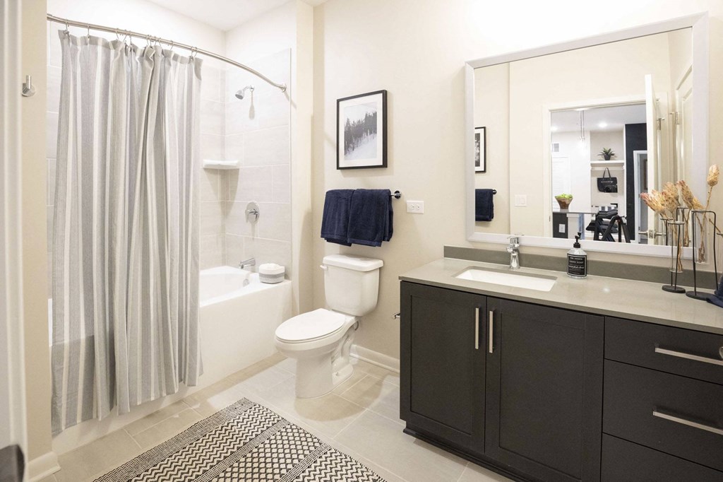 a bathroom with a sink toilet and a shower