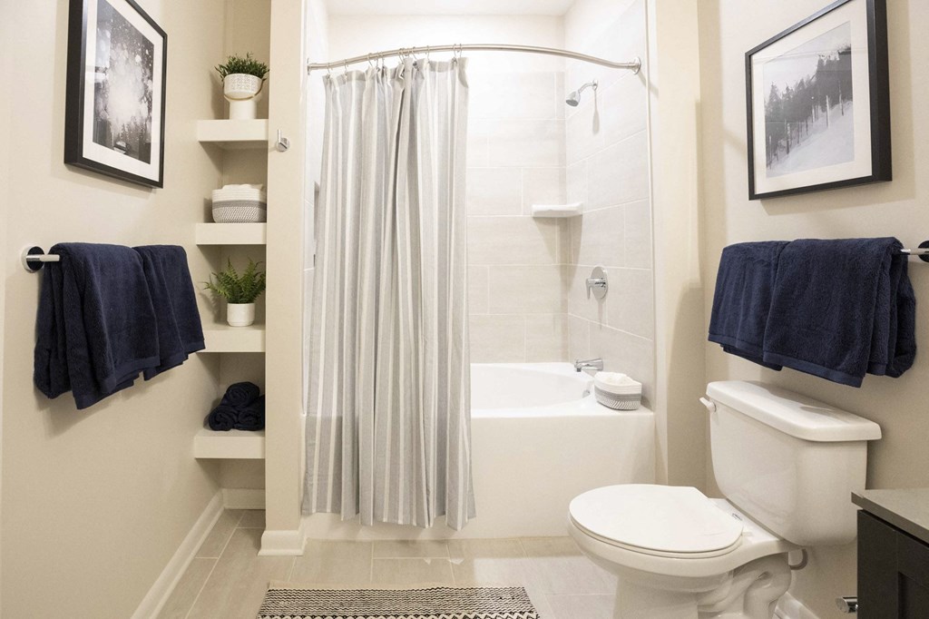 a small bathroom with a shower and a toilet and a sink