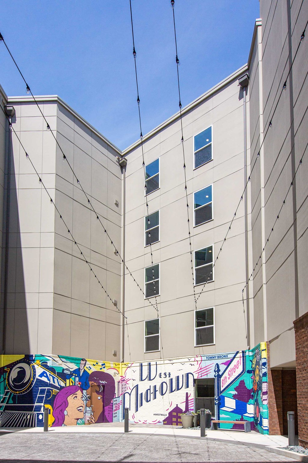 the side of a white building with graffiti on it