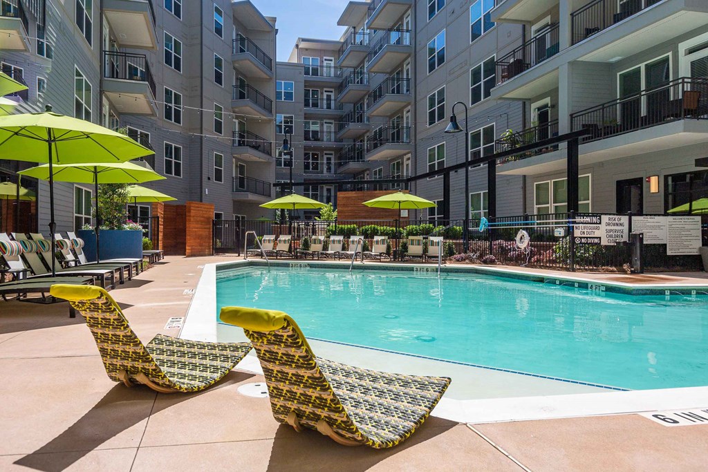 our apartments have a large pool and lounge chairs