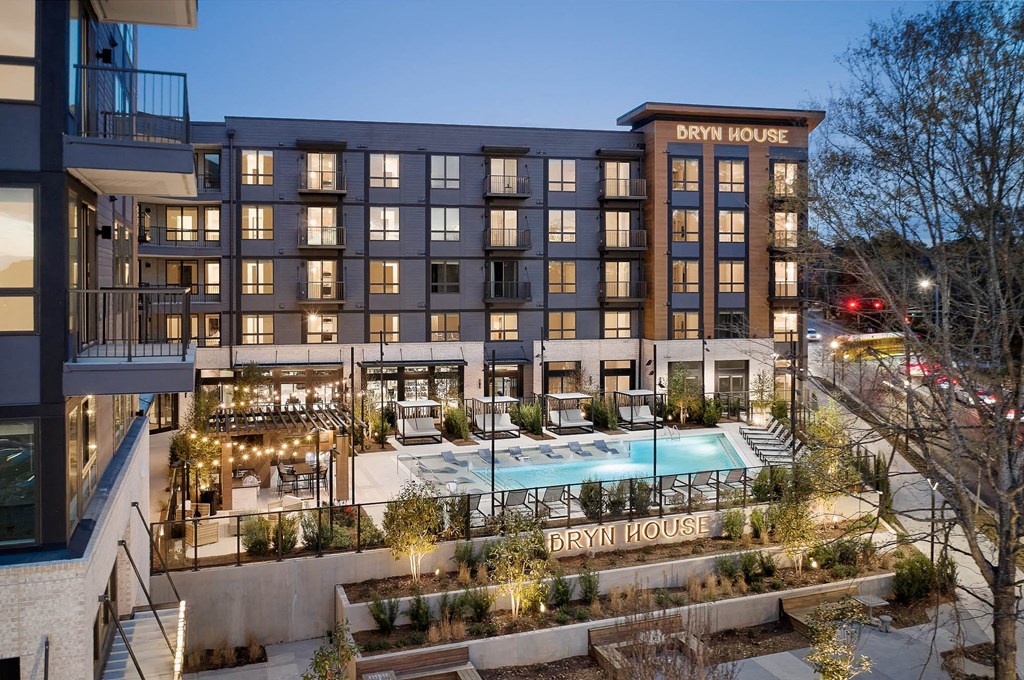 a rendering of the berry house at night with a pool