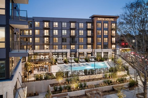 a rendering of the berry house at night with a pool