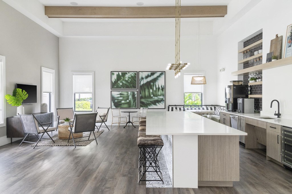 a living room with a kitchen and a dining room
