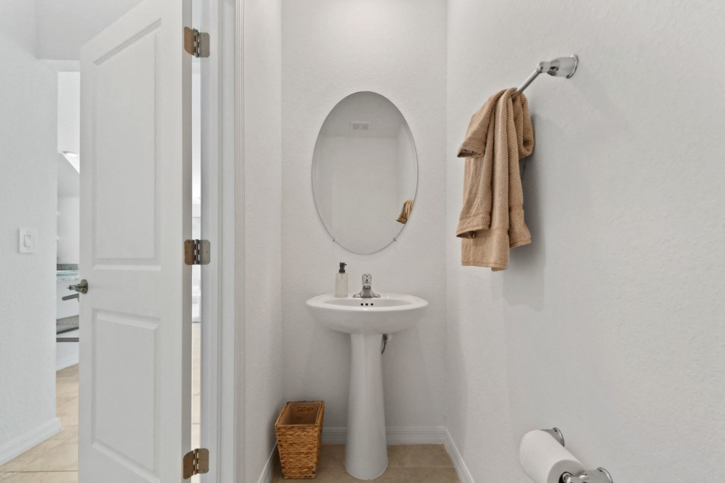 a small bathroom with a sink and a mirror