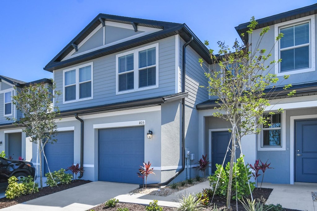 a blue and with blue garage doors