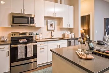 Ultra-Modern kitchens with quartz countertops and porcelain tiled backsplash