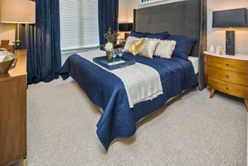Wood-plank style flooring with berber carpeting in the bedrooms