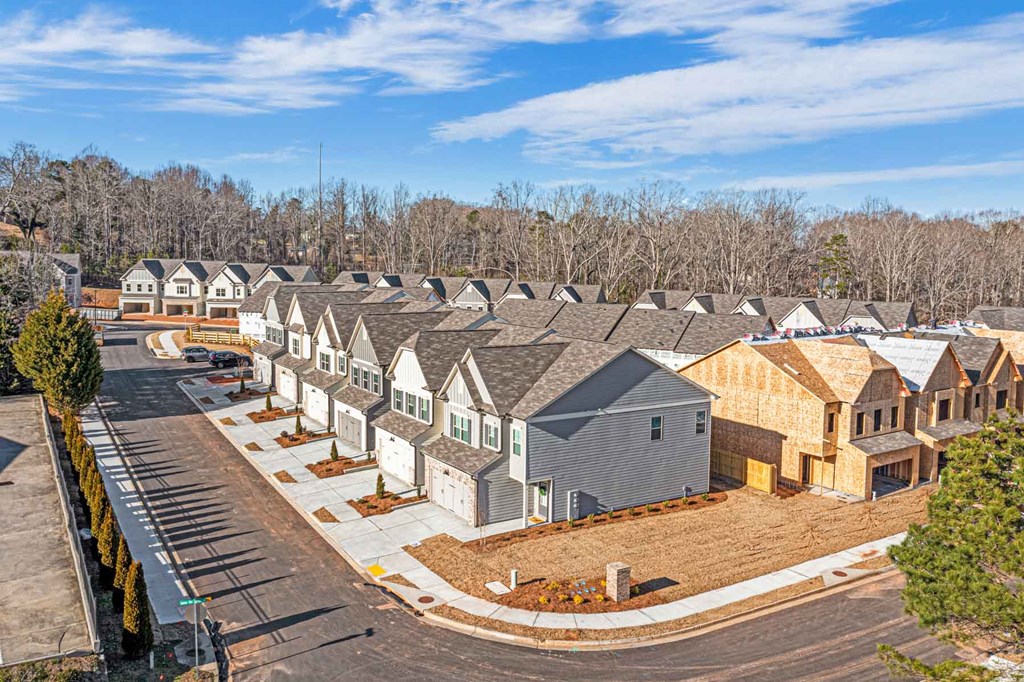 an aerial view of a row of houses on a street