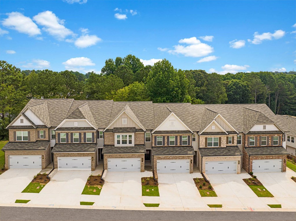an aerial view of a row of houses with garage doors