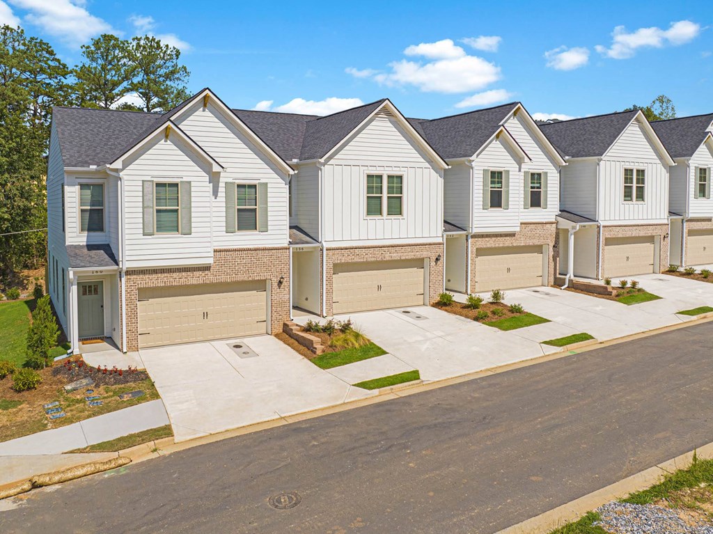 a row of houses on the side of a street