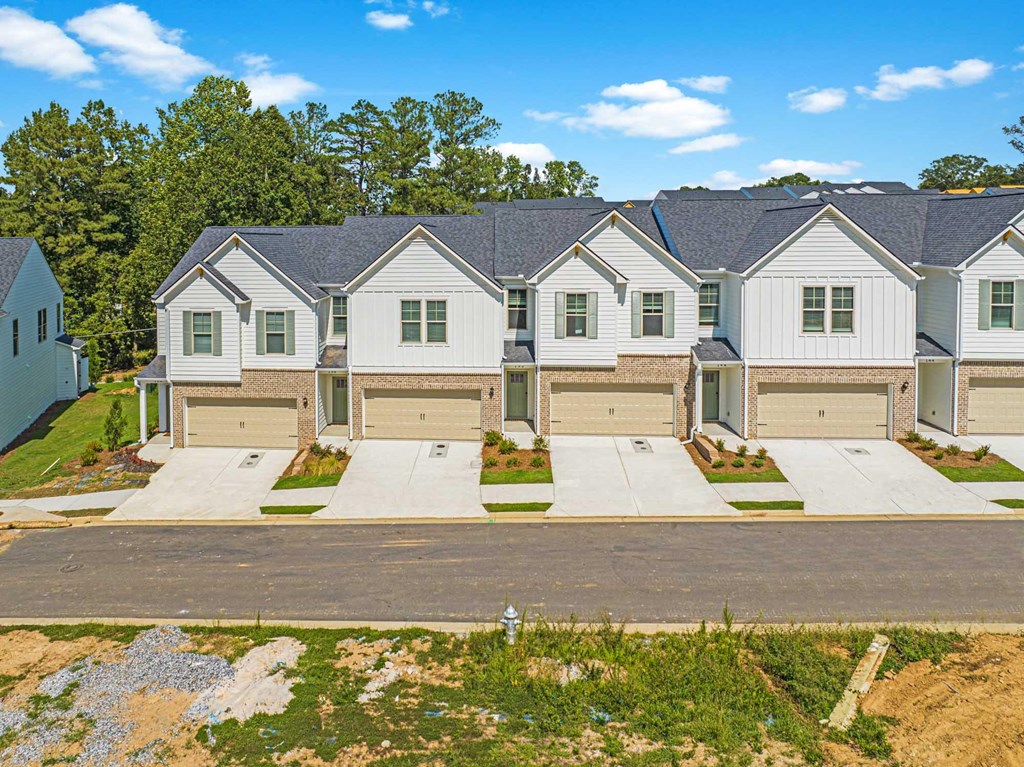an aerial view of a row of houses with garage doors