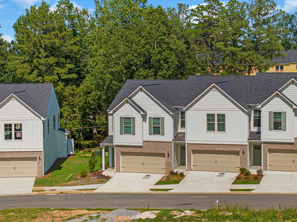 a row of houses on the side of a street