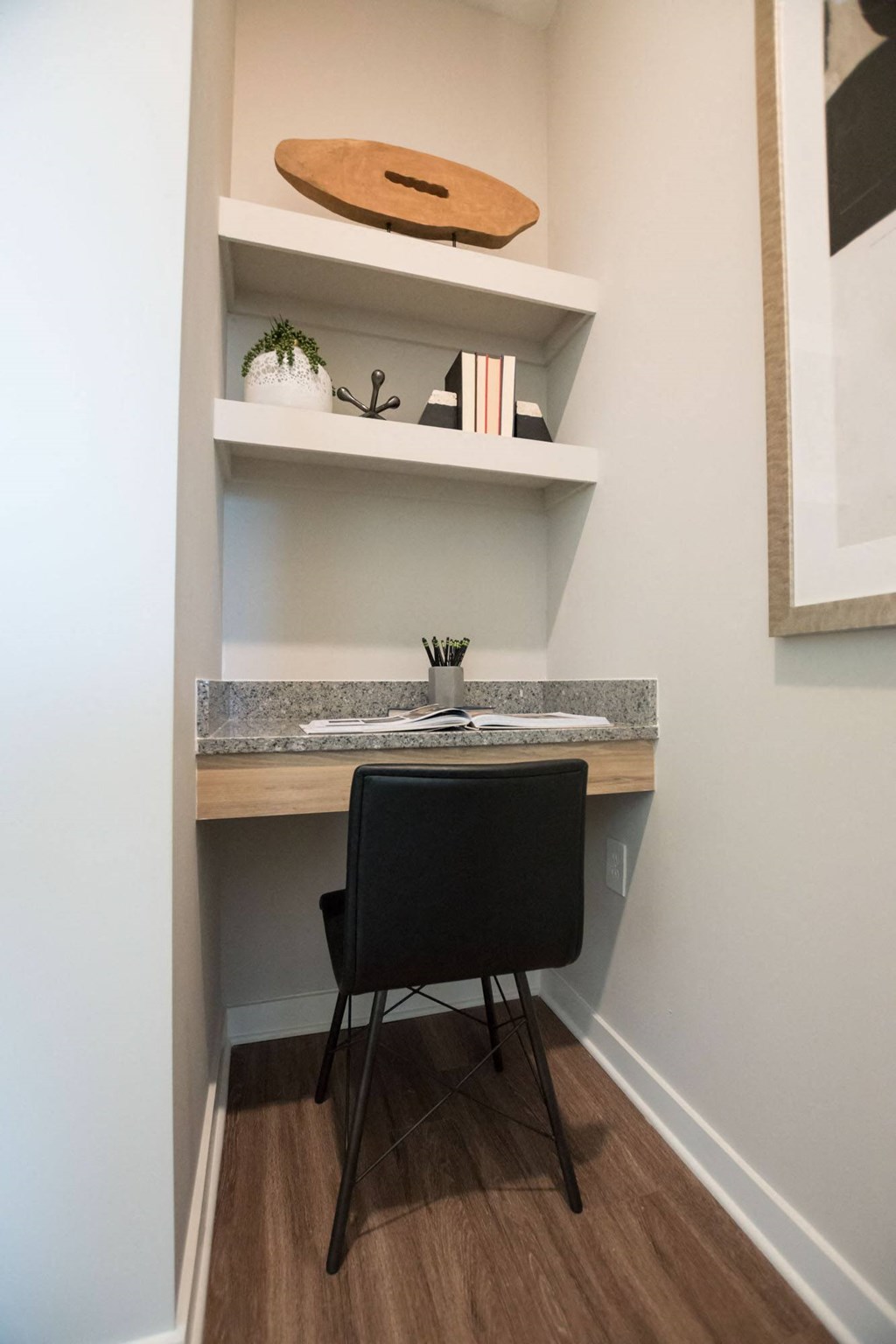 a small desk with a chair in a room