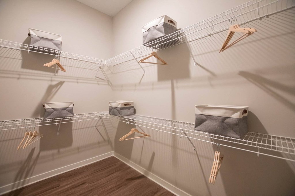 a room with a bunch of wire bins in it