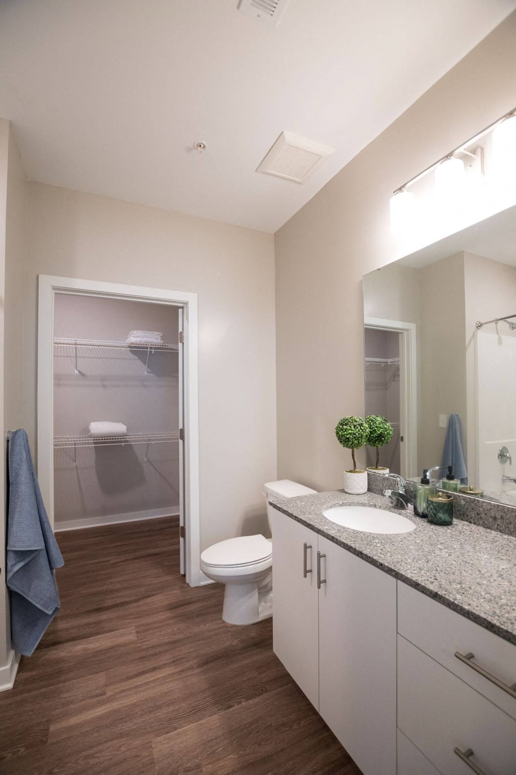 a bathroom with a toilet and a sink and a shower