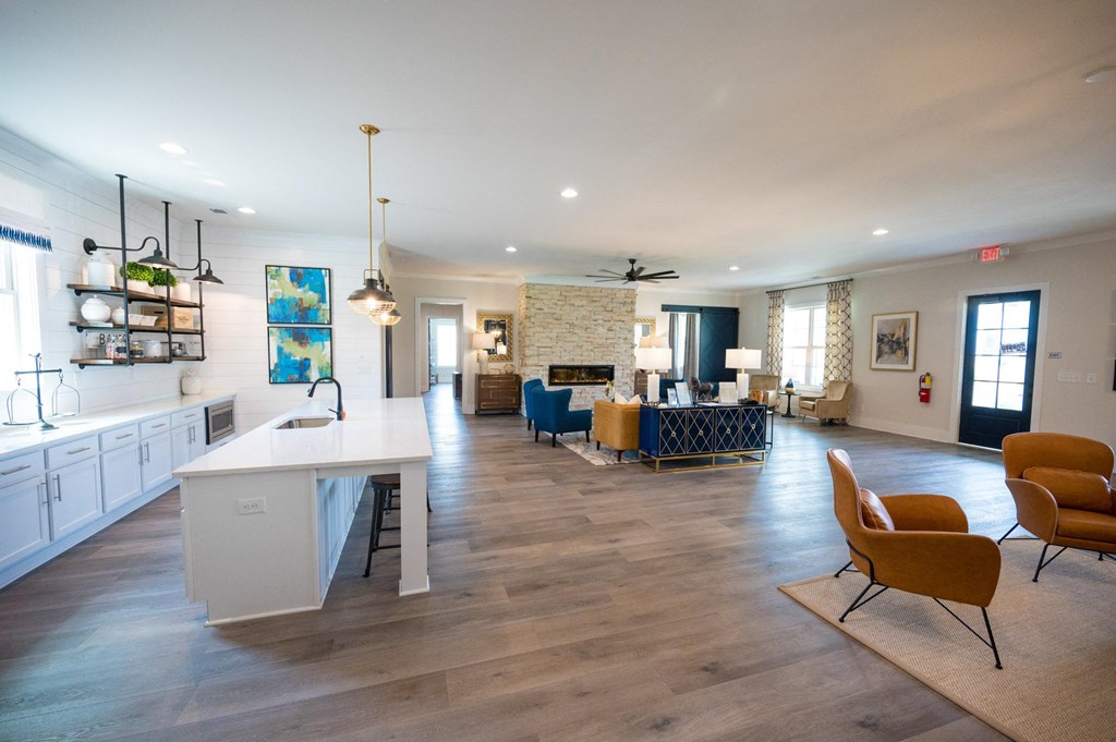 a large living room with a kitchen and a dining room