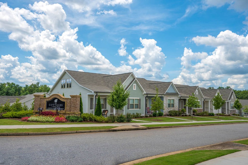 a row of houses on the side of a street