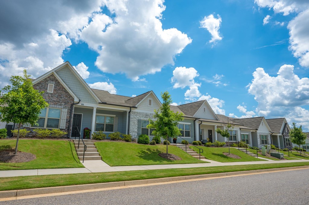 a row of houses on the side of a street