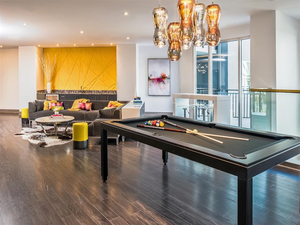 a living room with a pool table