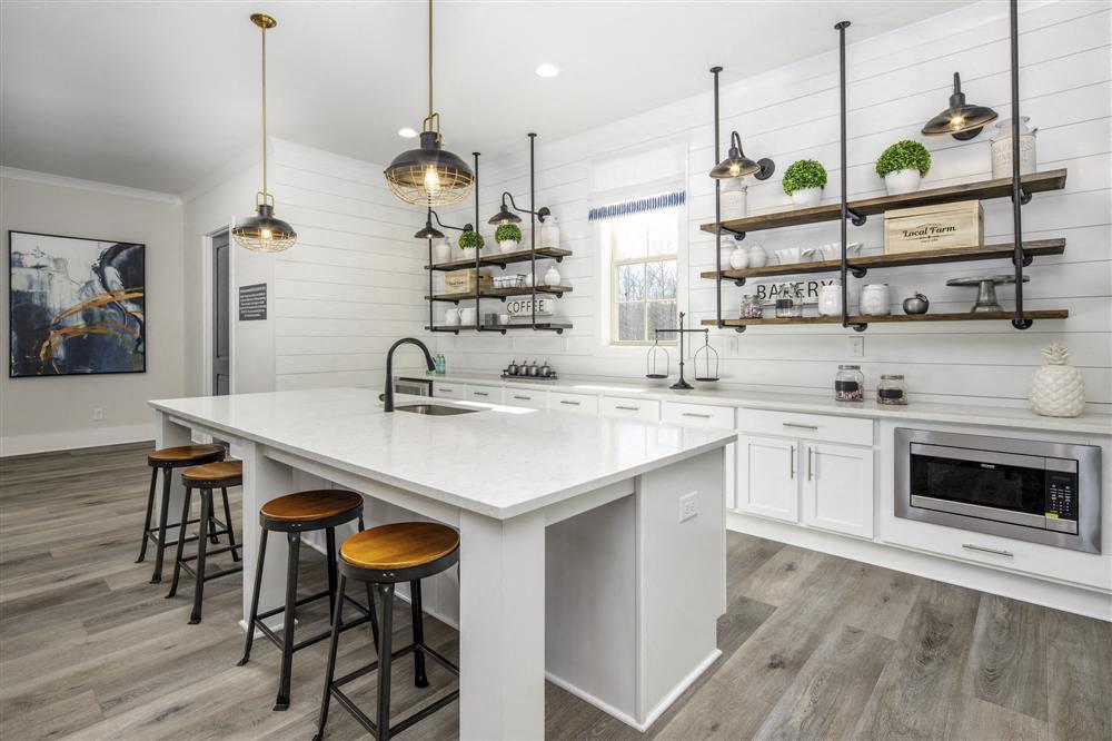 a kitchen with a large white counter top
