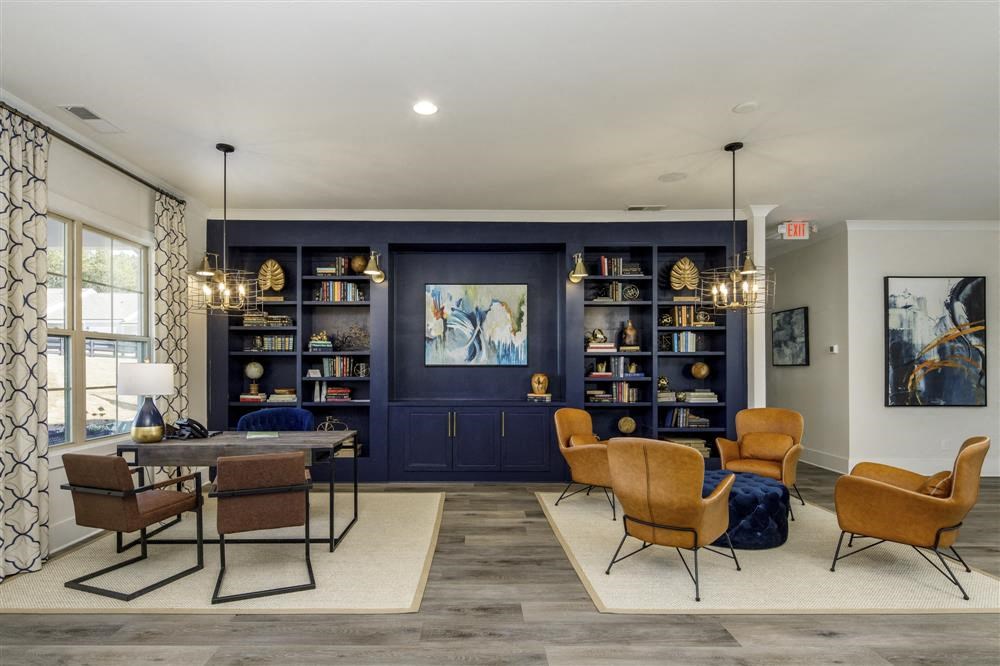 a living room with a table and chairs