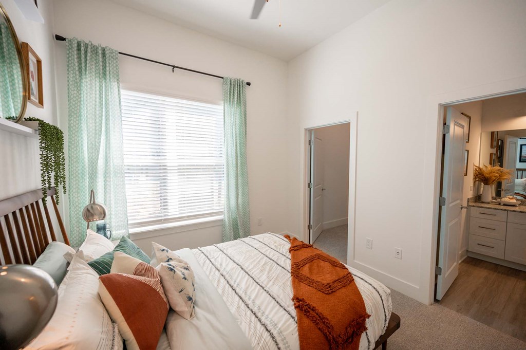 a bedroom with a bed and a closet