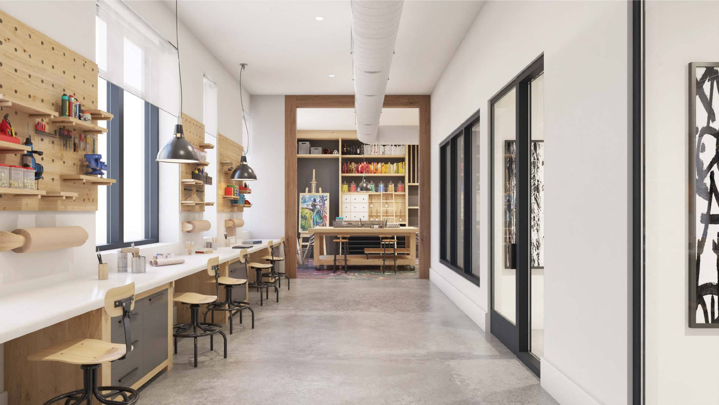 a room with a long counter and stools