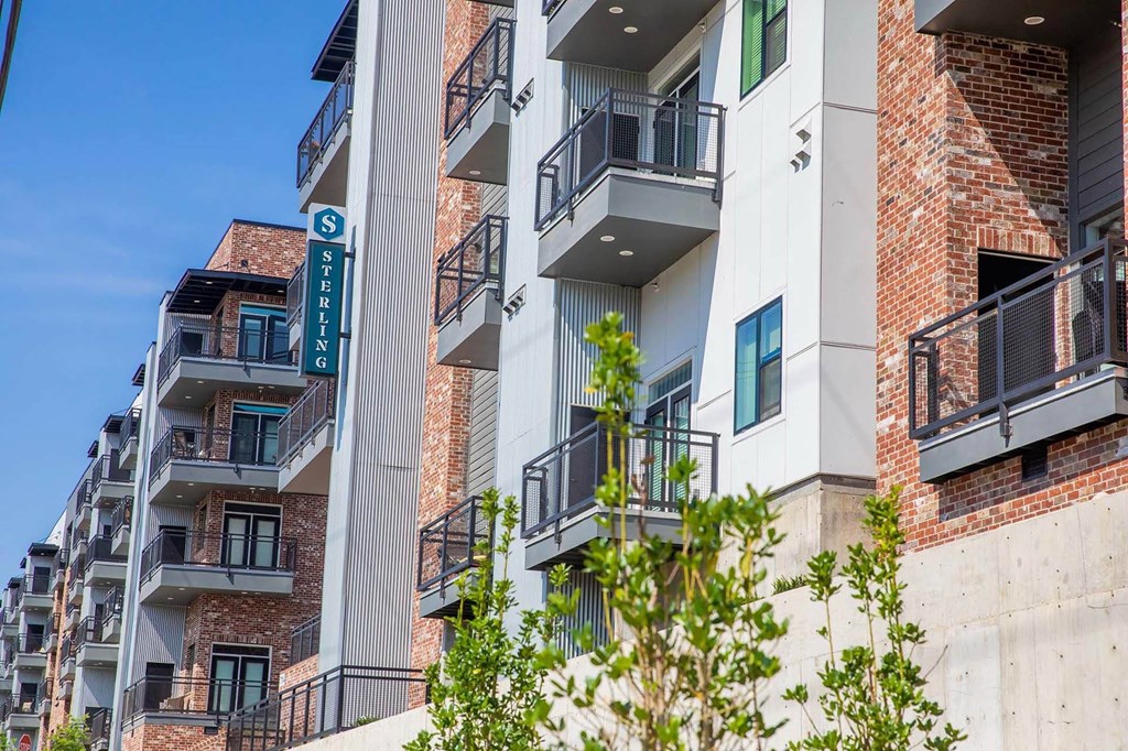 an apartment building with balconies and a street signat Sterling Nashville West Apartments, Nashville, Tennessee
