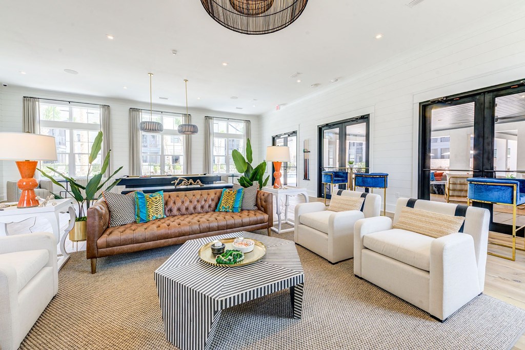 a living room with couches and chairs and a coffee table