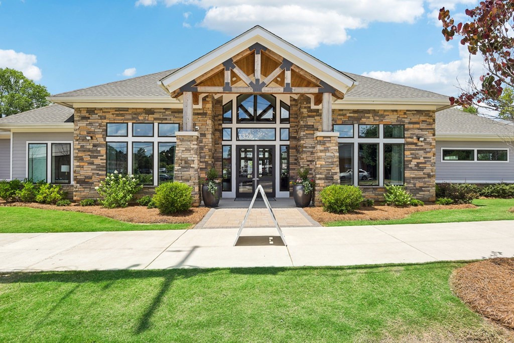 the front of a building with a sidewalk in front of it