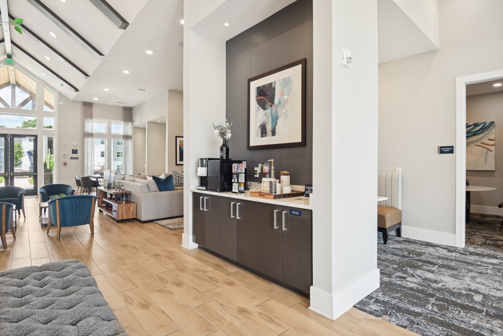 a living room with a kitchen and a dining room
