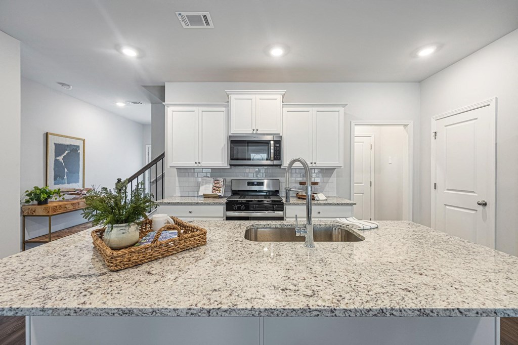 a kitchen with a counter top and a sink