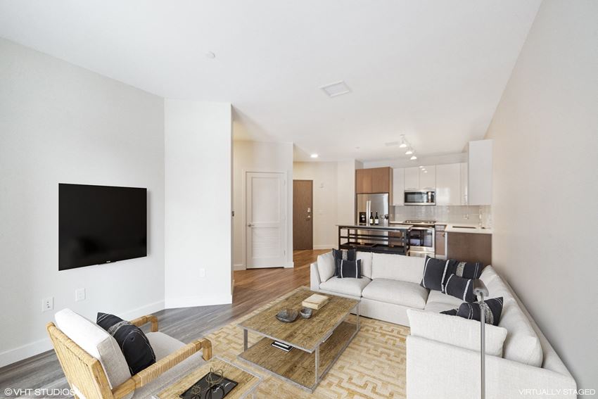 Large spacious living area with plenty of space to entertain Large, open spacious living area at Edison in the Charles by Windsor, Massachusetts.. - Photo Gallery