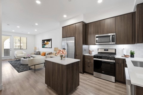 Gourmet chef-inspired kitchens, complete with quartz countertops and a luxury island at Windsor Rancho PQ in San Diego, CA, 92129