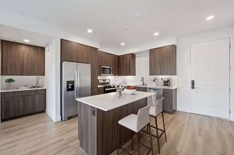 Stunning kitchens feature quartz countertops and backsplash at Windsor Rancho PQ in San Diego, California