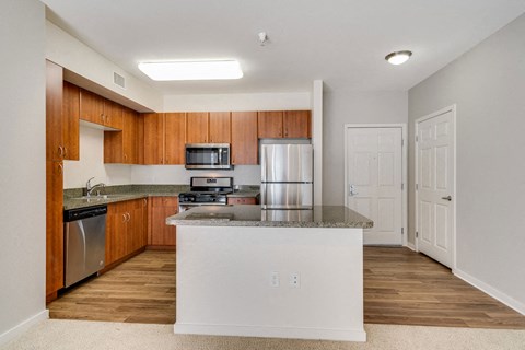 a kitchen with a counter top and a refrigerator