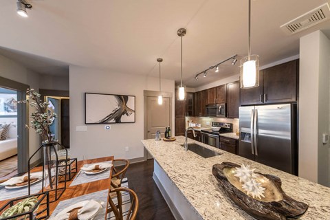 a kitchen with stainless steel appliances and a counter top