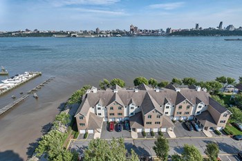 Aerial view of building near water at Windsor at Mariners, Edgewater, NJ