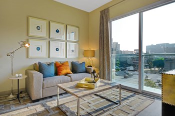 Large windows with views of Downtown LA from Living Room at South Park by Windsor, 90015, CA - Photo Gallery 6