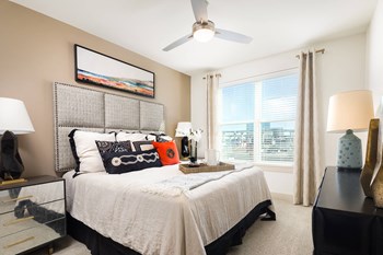 Large bedroom windows with stunning views at Metro West, 8055 Windrose Ave, TX - Photo Gallery 7