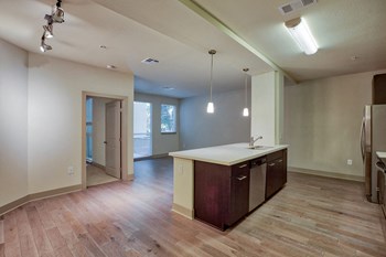 Wood-Style Flooring in Entry, Kitchen, Living and Dining Areas at South Park by Windsor, 90015, CA - Photo Gallery 13