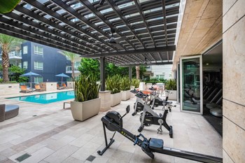 Outdoor Spin Bikes With A Pool View at South Park by Windsor, 939 South Hill Street, Los Angeles - Photo Gallery 30