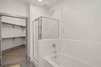 the preserve at ballantyne commons apartment bathroom with tub and shower