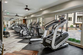Workout equipment in gym at Windsor Preston, 7950 Preston Road, 75024