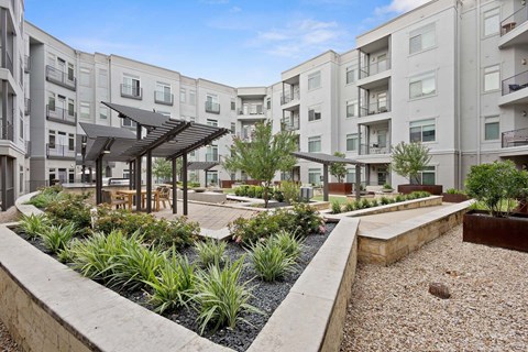 A modern courtyard at Eleven by Windsor 811 East 11th Street Austin, TX 78702