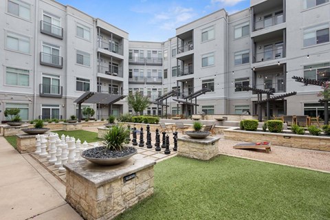 A modern courtyard at Eleven by Windsor 811 East 11th Street Austin, TX 78702